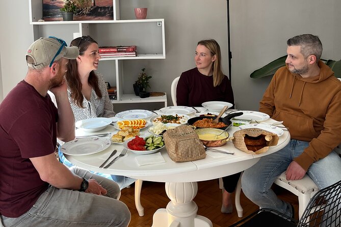 Authentic Turkish Antioch Breakfast with Local Sisters - Adding eggs with sucuk to the table
