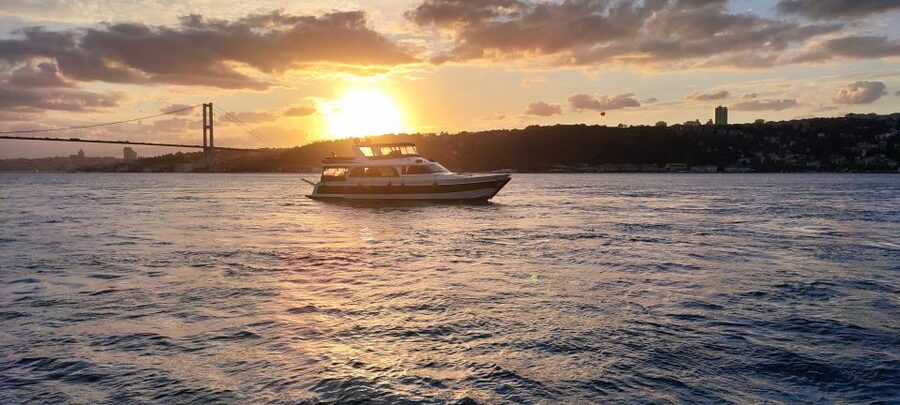 Istanbul: Bosphorus Sunset Cruise with Snacks and Wine - Reaching the Fatih Sultan Mehmet Bridge