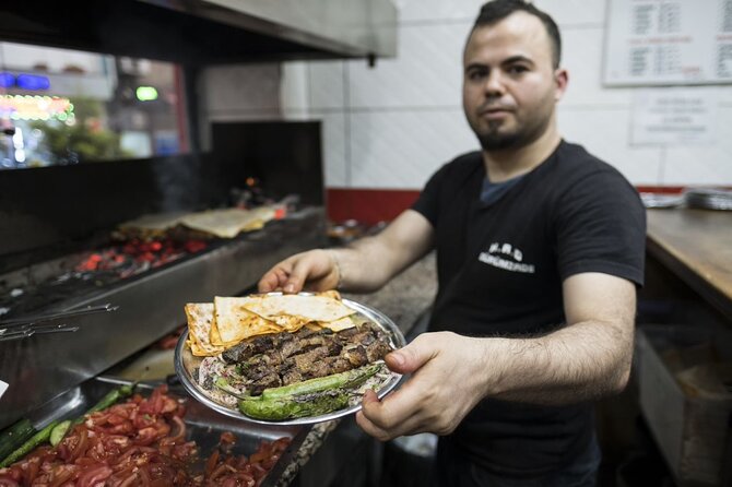 Istanbul Evening Food Tour: The Best Bites of Taksim and Karaköy - Walking through crowded central streets