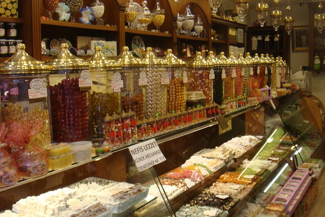 Istanbul Food Walking Tour of Beyoglu by Night - Walking Istiklal Caddesi toward the old arcades