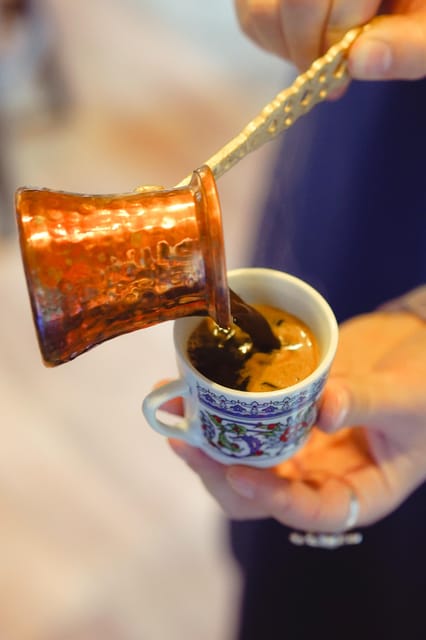 Istanbul: Turkish Coffee Making and Fortune Telling Workshop - Grinding the beans and using a cezve